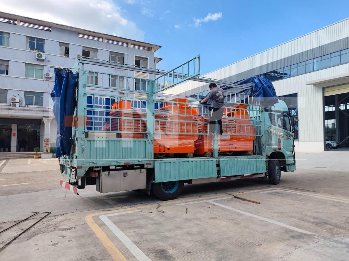 Customized 2.5 ton battery mine locomotives protected and loaded for delivery to the mine park.png