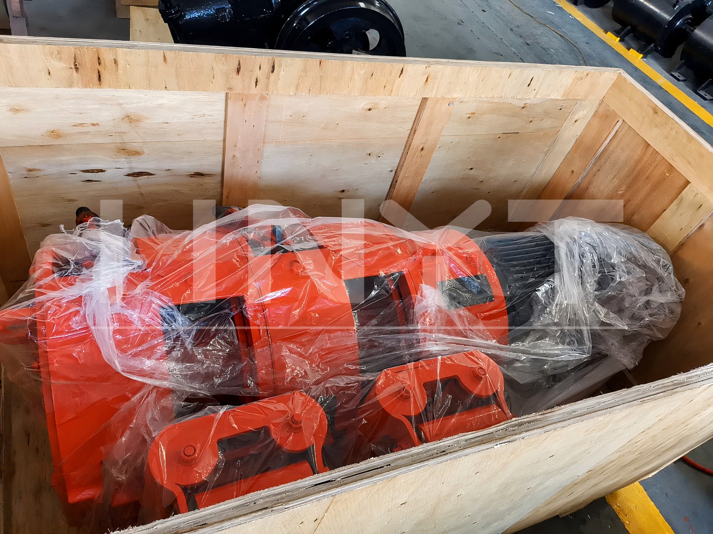 The mining rake winch wrapped for protection inside an open wooden case.jpg